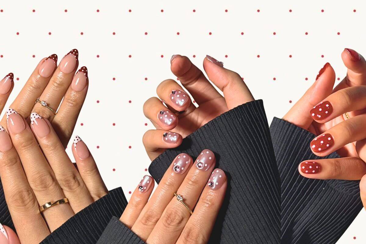 hands wear press-on nails with different designs of polka dots