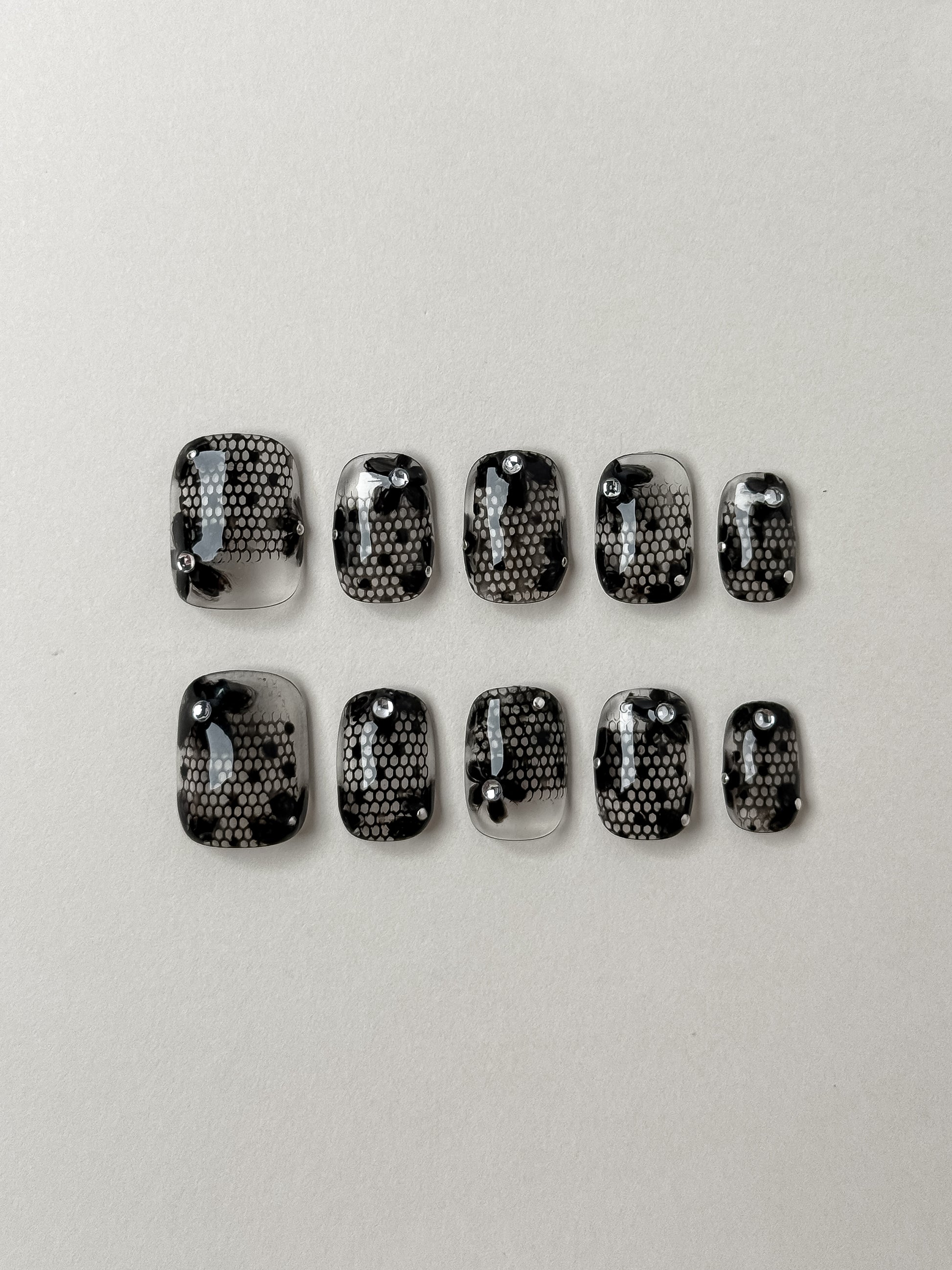 10-piece short square transparent press on nail set featuring black lace art