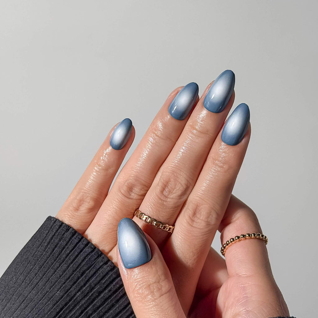 Close-up of blue magnetic gel press-on nails showing the multidimensional velvet shine.