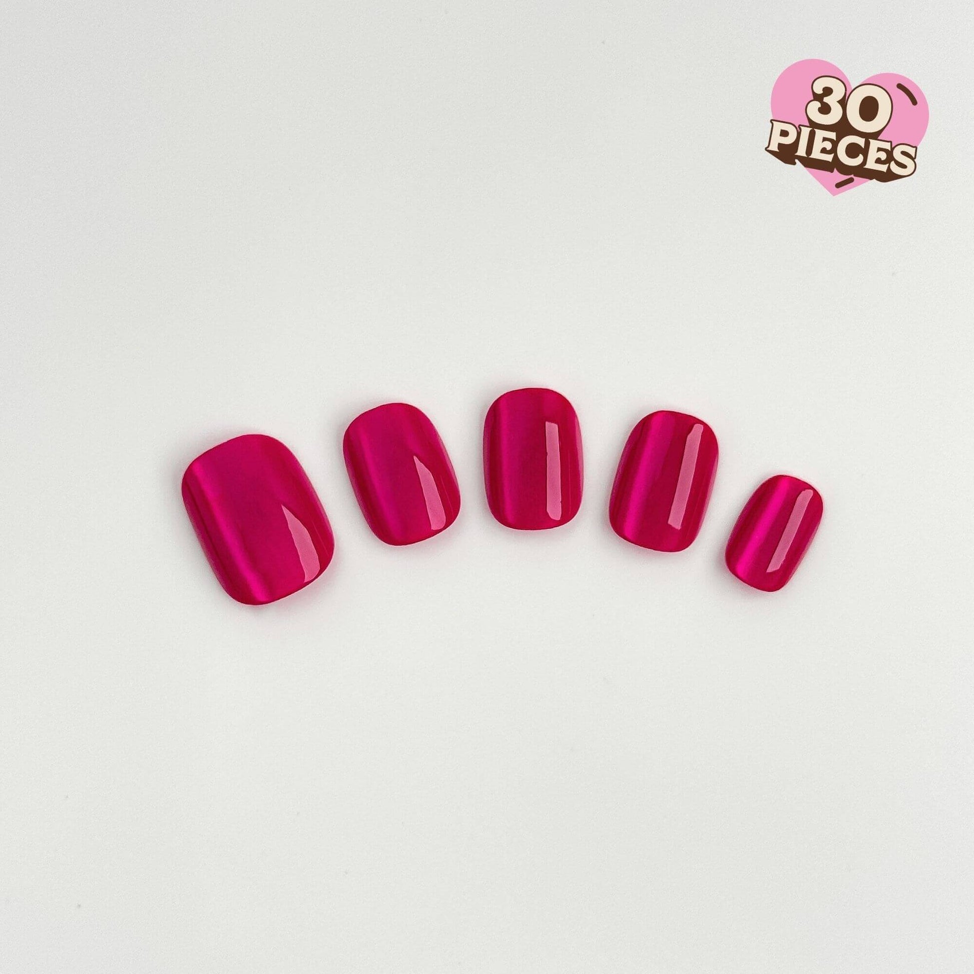 Glossy berry pink press-on nails with a shimmering cat-eye effect in a short squoval shape.