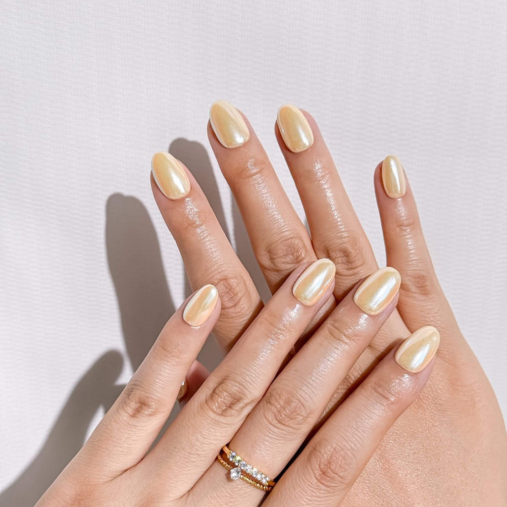 Professional lifestyle shot of handmade Champagne Glaze chrome nails, showing a realistic and elegant salon-look.