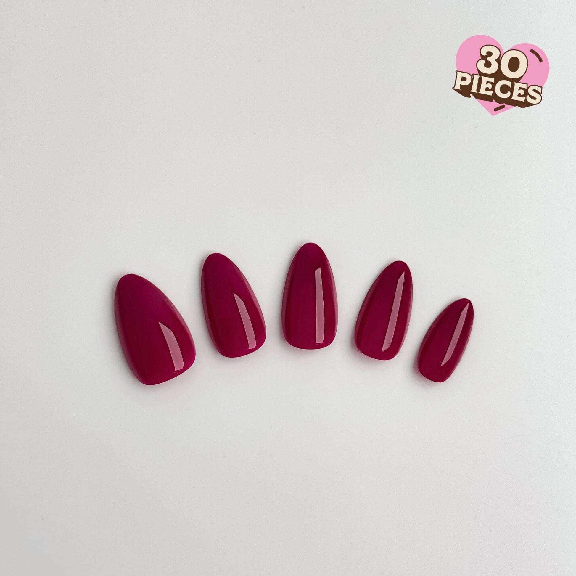 Five glossy magenta press-on nails in a medium almond shape.