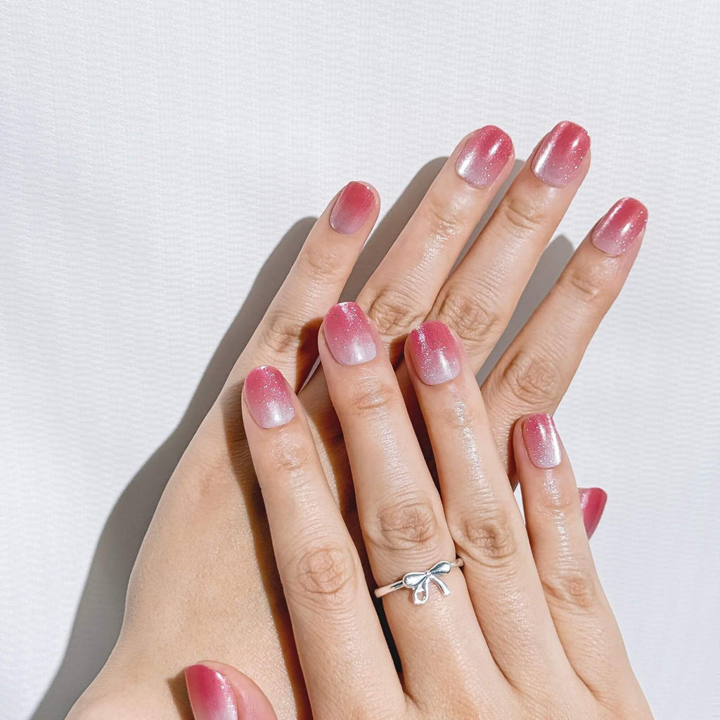 Sparkling manicure look with Justmee Sugar Plum Fade glitter stick-on nails, short length for a festive and trendy style.