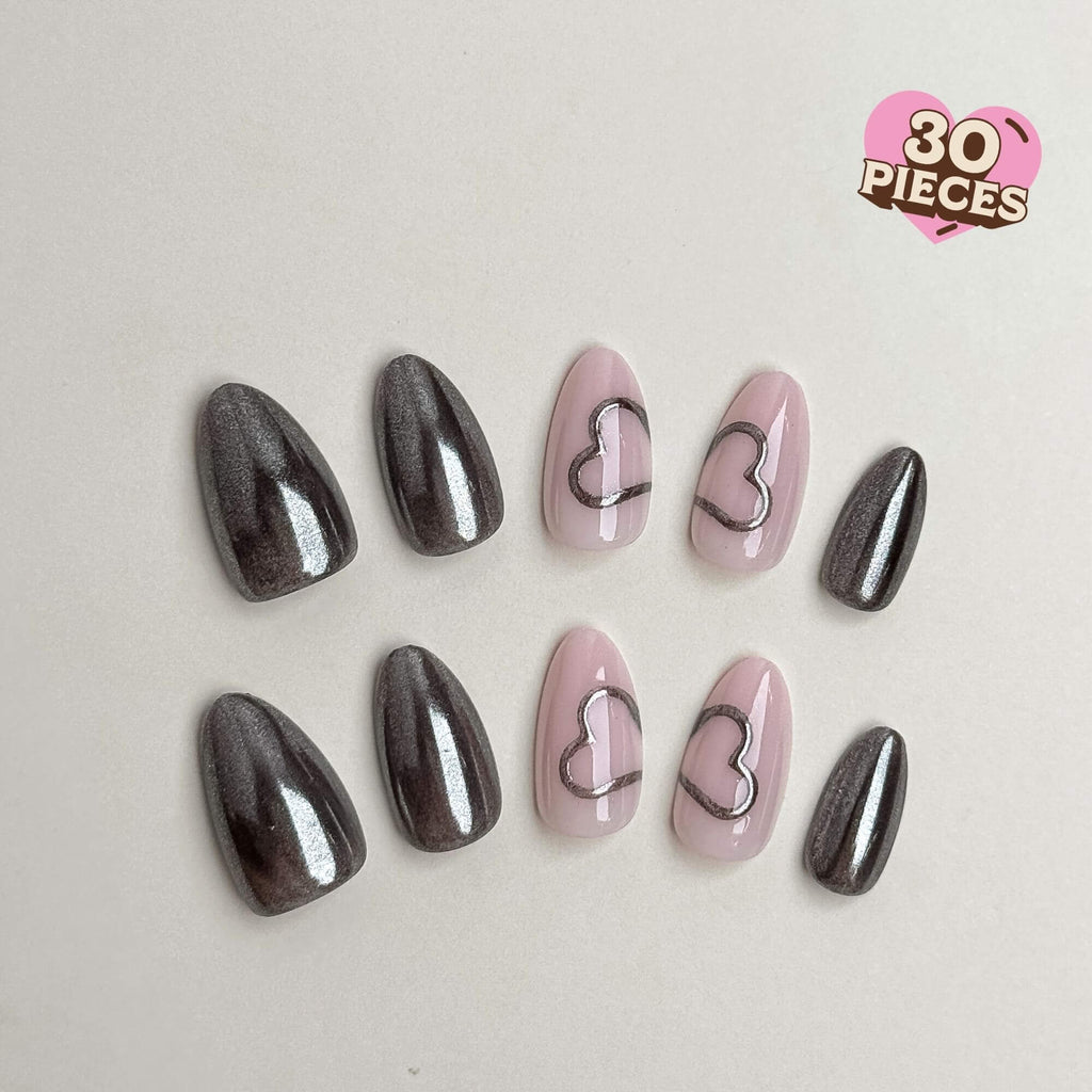 30-piece almond press-on nail set featuring gunmetal chrome and pink heart outline art. Medium almond shape and reusable.